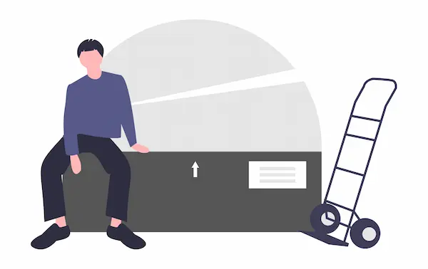 作業服を着てカートの前で肉体作業をする人物のイメージ画像